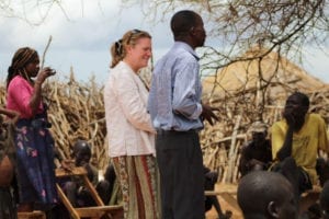 Woman missionary and Ugandan man standing beside each other