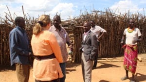 Missionary talking to Ugandan residents and officials