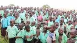 Many Ugandan students in mint green uniforms